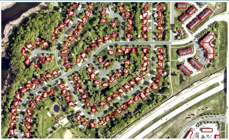 Aerial imagery showing residential units outlined in red as detected by the AI model