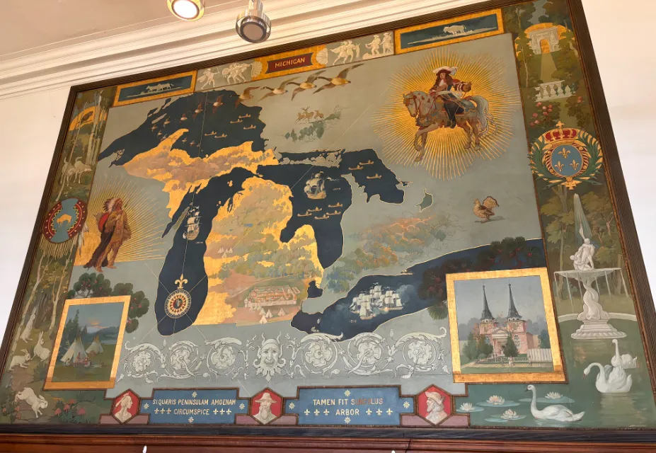 colorful map of Michigan and the Great Lakes. Fountains, animals, tents, and buildings make up the border, while on the map an Indigenous man and a European man on a horse face each other from opposite corners